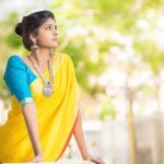 Niranjani Ahathian (14) yellow saree big necklace model pose