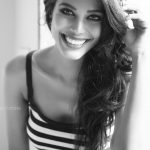 natasha suri in black dress black and white stripes glamour