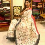 bhavana white saree pose in shop(15)