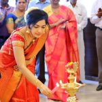 ramya vj candid pic at opening of tanishq showroom red and golden saree traditional look jewellery kuthuvilakku 2