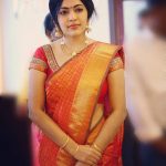 ramya vj candid pic at opening of tanishq showroom red and golden saree traditional look jewellery2