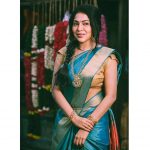 ramya vj in blue silk saree golden blouse and gold jewellery traditional look