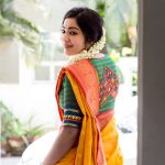 ramya vj in yellow silk saree jasmine flowers traditional look back pose with green blouse