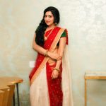 ramya vj white and red half saree with green blouse