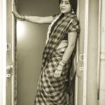 ramya vj with checked saree jasmine flowers and jewellery black and white pic