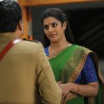 Kaatteri, green saree, Varalaxmi Sarathkumar