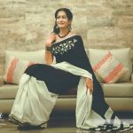 megha mathew in black and white saree sitting on sofa  (1)