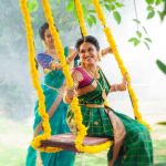 Indhuja, green saree, unjal, playing