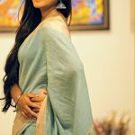 Neethu Vasudevan, blue saree, yellow light, side pose