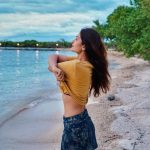 Payal Rajput, beach, yellow t shirt, side pose