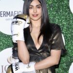 Adah Sharma Instagram - 💥BOOM💥 . Boxing gloves on the red carpet ! I think thats a first (coz I googled to check and didn't find any actor internationally either 👻 ) So we did the newspaper gown and then the lehenga with the bomber jacket and u guys always support the crazy stuff i do...I thought let's knock out everyone on the red carpet for @globalspa_mag Fit and Fab awards #commando3 is coming sooooon so Bhavana Reddy is in full form 😁 Pics @ajaypatilphotography . P.S.Bhai doosri heroines copy mat karna aur agar copy karna hai toh pretend mat karna ki original hai 😬😁🤭 bhagwaan dekh Raha hai sab!! enjoy 😜