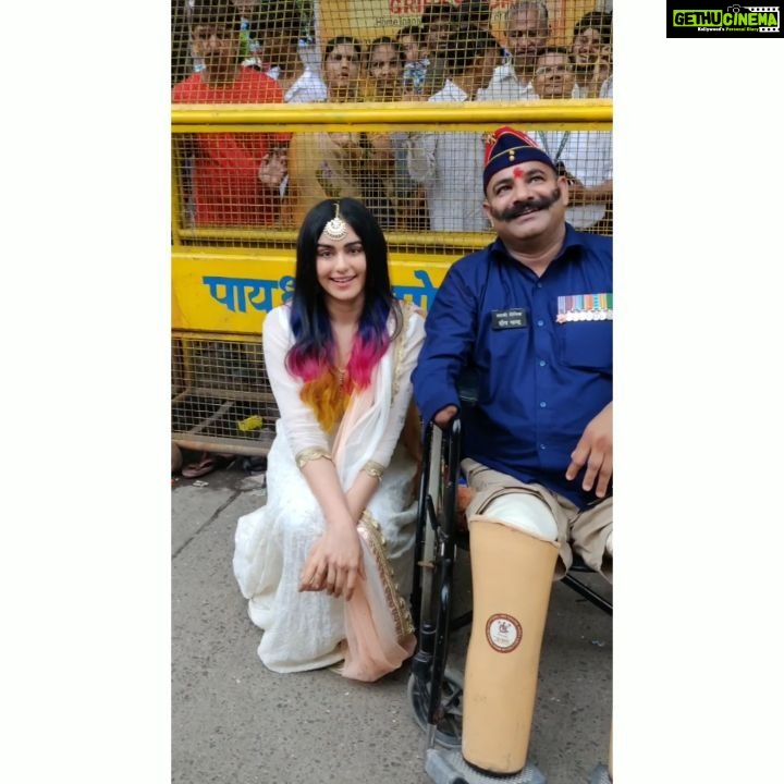 Adah Sharma Instagram - Went to meet lord Ganesha but found God was sitting outside too πΌπΌπΌ . Yesterday my team and me were invited to a Ganesh Mandal..Due to security reasons we couldn't go inside. And then i met sir DeepChand a real life Commander sitting outside with a big smile and sparkling eyes! He said he's watched Commando 2 and is looking forward to Commando 3.I felt very lucky that he wanted a picture with me ! . Happiness is a choice and not entirely depended on external situations of which we have no control at all....(and on instagram we have people who complain about the existance of mondays π)Naik Deepchand lost both his legs and his right arm when he fought in the 1999 Battle of Kargil.This year marks the completion of 20 yrs of the war