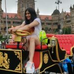 Adah Sharma Instagram - Who wants to go for a drive ? Tag a friend who you'd take on this ! . The E Victoria's are being launched on 1st September !!! . . Where to ? Now i only have to find a Leonardo Dicaprio type human (like him from The Titanic) to ask me and then i can say to the stars !!! . . My Star kid Radha Sharma @adah_ki_radha gets a free ride on the first E Victoria ! My humble daughter is sitting in the rain without complaining also !! So kind hearted 🥰