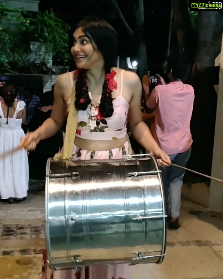 Adah Sharma Instagram - It's a HIT !!!!! So we did this surprise visit at a multiplex at 12 in the night and it was houseful and you guys were soooo enthusiastic ! Multiplex mein ! Soooo cool ! The dhol video was later at Dr Rajashekhar's house . Beating my own drums πππ this was funnn ! Now I need a "HOLIDAY"(plug in for my next project) We are also standing on a narrow bar type thing balancing on it. My hands r hurrrrting now ! bajaoing dhol should be a workout . Bajaoing dhol Adah Sharma style (I got a little excited otherwise I'm very posh) #adahmadness . Director @prasanthvarma3.0 to my left , Dr Rahashekhar to my right @siddheshnakhate making sure I don't fall , @aditiagarwal_official being my main bouncer and @snehal_uk my dopπ
