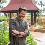 Anil Kapoor Instagram – @kapoor.sunita ❤️ Repost from @officialhumansofbombay – “A friend of mine gave Sunita my number to prank call me––that’s when I first spoke to her & fell in love with her voice! Soon after, we met at a party––there was just something about her. We started talking & became friends. We used to discuss this other girl I liked – you know, if I like her or she likes me? Then suddenly that girl vanished, leaving me heartbroken – our friendship strengthened because of that! 
Little did I know that Sunita was the one all along – we started dating organically. It’s not like in the movies––I didn’t ask her to be my girlfriend––we both just knew. 
She was from a liberal family––a banker’s daughter with a modelling career & I was bekaar! She didn’t care who I was or what my profession is – none of it mattered! I lived in Chembur & she lived on Nepeansea road – it took me an hour to reach by bus. She would start screaming, ‘No come fast by cab!’ & I’d say ‘Arrey I don’t have money’ then she’d say ‘Just come na’ & pay for my cab! 
We dated for 10 years––we travelled and grew together. She was always clear that she won’t enter the kitchen. If I said ‘cook’ I’d get a kick! I knew I needed to become something before asking her to marry me. I went through the struggle of not getting work, but she supported me unconditionally. 
So when I got my first break, ‘Meri Jung’ I thought, now house will come, kitchen will come, help will come…I can get married! So I called Sunita & said, ‘Let’s get married tomorrow – it’s tomorrow or never’ & the next day, we were married! 
I went for shoot 3 days later & madam went abroad on our honeymoon…without me!
Honestly, she knows me better than I know me. We’ve built our life; our home together. We’ve raised 3 kids & been through ups and downs. But I feel like we’re finally dating now – romantic walks & dinners have just begun!
We’ve been together 45 years––45 years of friendship, love & companionship. They don’t make people like her anymore. She’s the perfect mother, perfect wife & the reason I wake up every morning, motivated. You know why? When I ask her, ‘Arrey, yesterday only gave you so much money’ she says, ‘Woh sab khatam ho gaya..