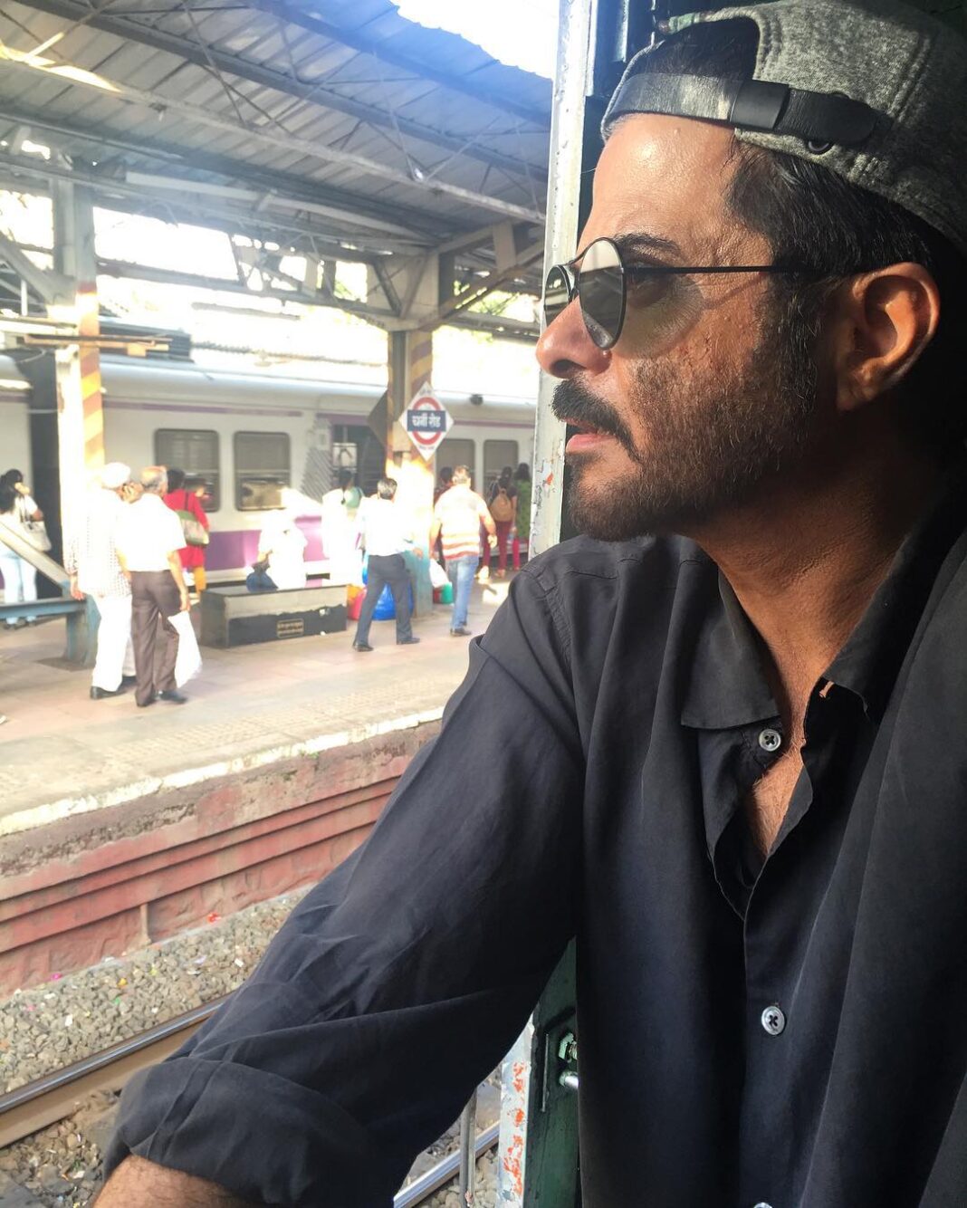 Anil Kapoor Instagram - Avoiding the visarjan traffic & earning brownie points for getting home on time with the wife! #MumbaiLocal #GanpatiBappaMorya Mumbai Local