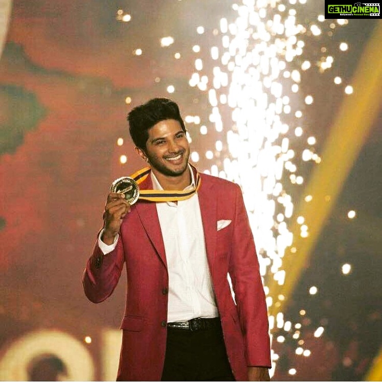 Dulquer Salmaan Instagram - Thank you Behindwoods for my Best Actor Critics award ! Feels epic to win a Gold Medal ! Was a lovely event and I had a blast. Always great catching up with friends from both Malayalam and Tamil industries. A big thanks to my buddy @osmanabdulrazak for my perfectly tailored suit and of course @kalyanidesai for styling me ! #behindwoods #awards #suited #walkingtheramp #feltspiffy #smance #worepinkforprincess #babyboo #suddenloveforpink #daddycool
