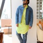 Jackky Bhagnani Instagram - 💚🙋‍♂️ . . Textured neon kurta: @deepakparwani Jeans: @diesel Shoes: @fila Denim jacket: @calvinklein Styled by: @rishabhk24 Assisted by: @mallaikaa07 📸 @mohit_essence