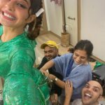 Jacqueline Fernandez Instagram – The awesomest @manishamelwani @sanyakapoor @shaanmu literally stitching the outfit on me! Team #bhootpolice #kanika @savleenmanchanda @marcepedrozo 💚💚💚 NEW SONG OUT NOW! Link in bio