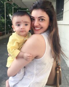 Kajal Aggarwal Instagram - With my little #ladoogopal #ishaanvalecha dressed as infant Krishna for a #bhagwadgita reading and prayer ceremony 😍🙏🏻 #eternalsunshine #masilove 💛❤️