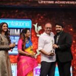 Keerthy Suresh Instagram - ❤️ for candids! #momanddad #sweetmoments #lifetimeachievementawards at @siimawards Wearing an antique sherwani by @rishtabyarjunsaluja & silver vintage guttapusalu by @amrapalijewels Fashion Stylist @styledbyindrakshi Fashion Assistant @rishi_chowdary M&H @moovendhar_makeup @hairbyrajabali