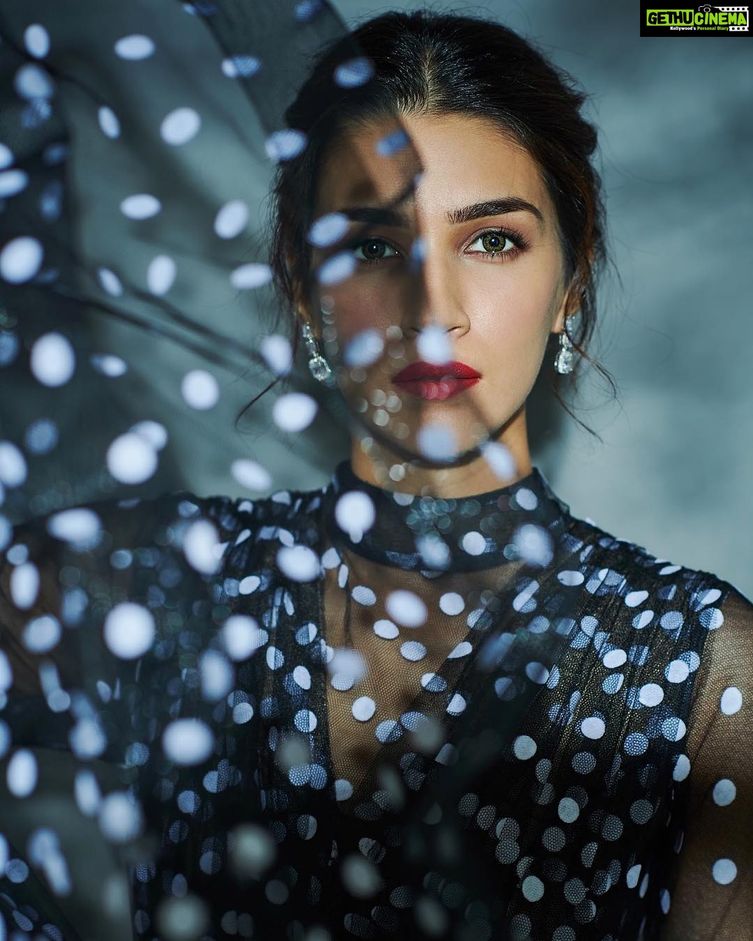 Kriti Sanon Instagram - She was like the moon -part of her was always hidden away. 🌗🌓🌔🌖