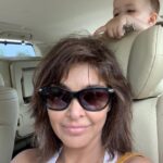 Lisa Ray Instagram - Frazzled hair and a Mona Lisa smile while Sufi either thoughtfully plucks my greys or attempts to penetrate mama’s cranium. End of a long, colourful day in #SentosaIsland. This is #motherhoodunfiltered 🙏🏼 Thanks @sameer.sain for the wheels ❤️