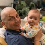 Lisa Ray Instagram - We are so proud of daddy and hubby extraordinaire for shaving his head to support kid’s cancer charity @stbaldricks after meeting his fund raising goal. Thanks to everyone who donated. #Souffle and I were there to cheer him on, and the girls are quite chuffed: they offered him their headbands and cute 🧢 as his first comment when we stepped out with his newly tonsured head was, damn it’s cold! Brought back deeply personal chemo memories, because you don’t realize how much heat escapes through the head until you don’t have hair 🙏🏼 As a mom today, it literally tears me up to imagine what children experience during cancer treatment, how their innate wisdom rises through difficulty and how easy for us to support their cancer journey. Makes me want to do as much as I can to ensure their survival. If you are moved, find an initiative that calls for your support today 🙏🏼
