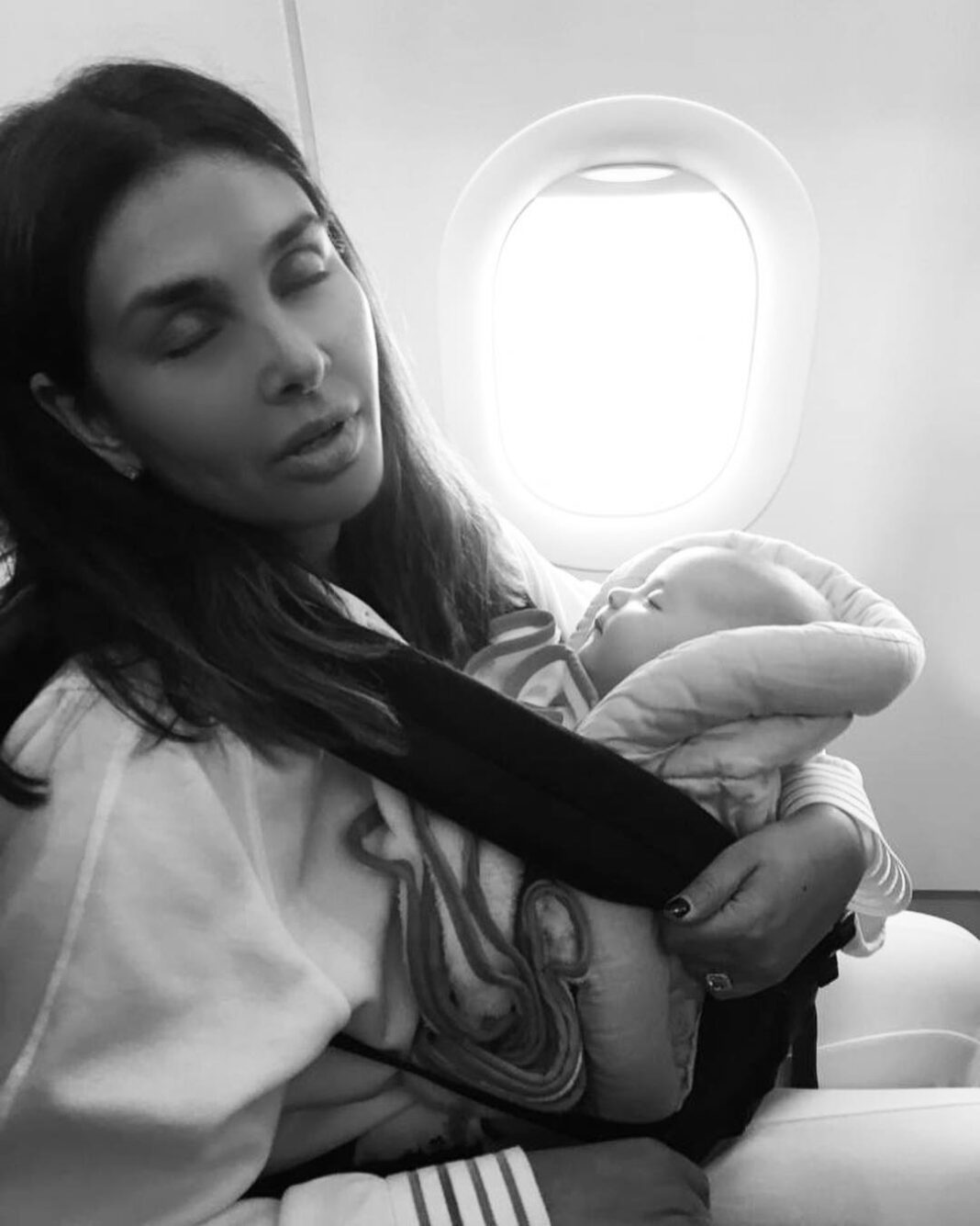 Lisa Ray Instagram - I once was that person: you know the one. The one who grimaced and shot dirty looks at anyone who brought an infant on a plane, then stage whispered: ‘I hope that kid is not sitting close to me. Oh god, can’t they drug their child just a little for the flight?’ Well...today even though I’m fortunate enough to have amazing back up - nannies - and resources - business class - let’s get real about this: travelling with babies is like mixing volatile chemicals in a high school lab: you just never know when the next explosion is coming 💥 #Souffle at six months, are already frequent fliers and I’m proud of it...I, on the other hand, might need a bit more practise flying with this new family configuration. All I know is when we are up in the air and people try to weigh me down with their accusatory looks in the middle of a fussy outburst, we soldier on in the wake of our sweet blessings with a twist of karmic revelation...what goes around comes around. And: ‘my baby is six months old. Don’t give me that look! Keep your headphones on and watch a movie, dude.’ #motherhood #therealstory