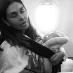 Lisa Ray Instagram - I once was that person: you know the one. The one who grimaced and shot dirty looks at anyone who brought an infant on a plane, then stage whispered: ‘I hope that kid is not sitting close to me. Oh god, can’t they drug their child just a little for the flight?’ Well...today even though I’m fortunate enough to have amazing back up - nannies - and resources - business class - let’s get real about this: travelling with babies is like mixing volatile chemicals in a high school lab: you just never know when the next explosion is coming 💥 #Souffle at six months, are already frequent fliers and I’m proud of it...I, on the other hand, might need a bit more practise flying with this new family configuration. All I know is when we are up in the air and people try to weigh me down with their accusatory looks in the middle of a fussy outburst, we soldier on in the wake of our sweet blessings with a twist of karmic revelation...what goes around comes around. And: ‘my baby is six months old. Don’t give me that look! Keep your headphones on and watch a movie, dude.’ #motherhood #therealstory