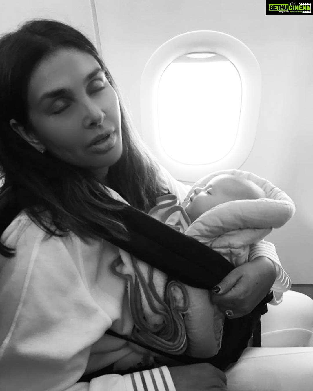 Lisa Ray Instagram - I once was that person: you know the one. The one who grimaced and shot dirty looks at anyone who brought an infant on a plane, then stage whispered: ‘I hope that kid is not sitting close to me. Oh god, can’t they drug their child just a little for the flight?’ Well...today even though I’m fortunate enough to have amazing back up - nannies - and resources - business class - let’s get real about this: travelling with babies is like mixing volatile chemicals in a high school lab: you just never know when the next explosion is coming 💥 #Souffle at six months, are already frequent fliers and I’m proud of it...I, on the other hand, might need a bit more practise flying with this new family configuration. All I know is when we are up in the air and people try to weigh me down with their accusatory looks in the middle of a fussy outburst, we soldier on in the wake of our sweet blessings with a twist of karmic revelation...what goes around comes around. And: ‘my baby is six months old. Don’t give me that look! Keep your headphones on and watch a movie, dude.’ #motherhood #therealstory