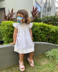 Lisa Ray Instagram - We wore our lovingly handcrafted @liz.jacob.designs dresses for our first day of Baby Ballet. Don’t miss our matching masks. 
Sandals @melissashoesindia 
#soufflé #SufiandSoleil #sustainablekidsclothes #Bangalore #Singapore