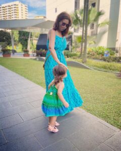 Lisa Ray Instagram - Here’s the thing I’m discovering about motherhood: there’s an undercurrent alternating between a primal protection impulse that bypasses all civilised conditioning and a drift towards engaged detachment that is spun from my mediation practise and experiments with expanding consciousness. 
There’s no need to resolve these two forces. They are not in opposition. Choosing the life of a householder (or rather life nudging me in that direction) has brought me more directly in the firing line of spiritual growth than I ever imagined.
I’m still an old romantic, not very sensible and prone to conceiving wild plans. So riding on the back of owning my eccentricities and freedoms is the practise of letting my kids just be. If I don’t want to be tamed, why would I do the same to these two? I have to keep them safe, fed, clean and alive and let them do their thing ✌🏼Love, as any mama knows, is the non- negotiable. We don’t need to mention it, because it just flows. 
Life is messy. Toddlers make messes in ways we’ve forgotten is possible (think mud, puddles, poop, yup all the organic elements) It’s all okay.
I wanted to share my attempt to pose with my girls this morning. As you can see they led me away from artifice and that’s just as well.
It’s the moments between posing that matter. 
Thank you @maishaconcept for my blooming, block printed marvel of a dress.