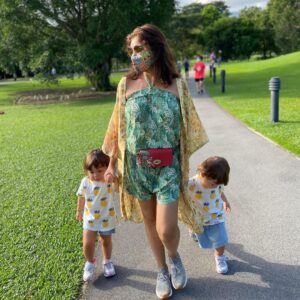 Lisa Ray Instagram - Took my @me_meraki saddlebag to the Botanic Gardens this morning for a test run. Only a mom of toddlers can appreciate how great it is to have a hands free, no fuss yet beautiful and artisanal bag to run with.
Since moving to Singapore I’ve enjoyed discovering local brands (Singapore and Hong Kong based) with a subcontinental heart. I resonate with @me_meraki mission to revive and sustain traditional Indian folk arts through their hand painted bags and clutches. (They also have vegan offerings!) Check out their evening clutches: they are pieces of art. 
‘Memeraki’ is inspired by the Greek word ‘Meraki’ which means to do something with utter devotion that leaves a little of your soul in your work. This alludes not only to the founder, but the India based artists who put their hearts into hand painting the bags.
With slow living and sustainable, ethical fashion a TOP of the mind priority, I pledge to support and highlight the work of more brands like @me_meraki that foster and represent the move towards greater ecological integrity and social justice, while producing one of a kind products to can cherish.
Mask @photophactorysg