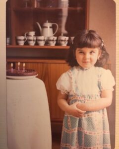 Lisa Ray Instagram - My daughters’ 2nd birthday is coming up. The ability to rejoice during difficult times is the hallmark of the human spirit. My husband has told me childhood stories of bombs falling during dinner parties in Beirut, where the guests would dive under the table and toast each other once they emerged and the danger had passed. We all have it in us to celebrate life’s contradictions. And here’s me at three ✌️ I can still taste the crunch of the first bite of that layered Polish biscuit cake. Lao Tzu once said: what is childhood but the memory of particular tastes?