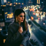 Nargis Fakhir Instagram - City living. 🌃 What city do you feel most at home in? . . . . . . . Photog @kashifrashid . Mua & Hair @malihajkhan . Styled by @rubyalgayar . Coat by @dinazakiofficial . Coordinated by @mahakbrahmawar . . . . #healthiswealth #womensupportwomen #bossbabe #powerofshe #citylife #cityscape #moodyports #portraits_ig #hudabeauty #makeupblogger