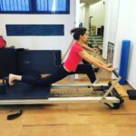 Nargis Fakhir Instagram - This is how I get longer legs, I have @namratapurohit stretch me out so I can appear taller and slimmer. #tricks #pilates joking but seriously if u guys & gals want to get strong and fit PILATES on the reformer is the way to go!