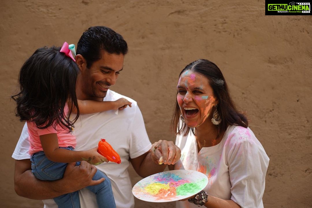 Neha Dhupia Instagram - #happyholi ... love ❤️ and laughter from ours to yours 😍