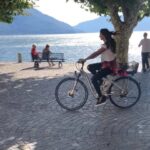 Pooja Hegde Instagram - Just @jrntr and I,cycling along side this beautiful Swizz lake,in between shots 😊🎥🚲 ..ending with Tarak scaring our photographer at the end by going too close to him 😂 #bts #throwback #aravindhasametha #funtimes Ascona, Switzerland