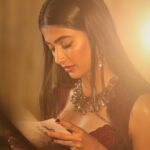 Pooja Hegde Instagram - Proof that if u give me something to read,I’ll be lost in it..#candid #presentingduties #Repost @iffigoa ・・・ Epitome of Grace & Elegance, @hegdepooja caught on lens at #IFFI2017 Photo by @dessaish