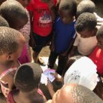 Priyanka Chopra Instagram - I love this picture..We don't speak the same language but we all seem to love bindis. Took some for the kids from India and they seemed to love them!! So much concentration! Ended up on noses too.. not just foreheads. #unicef #EndViolence #bindibonding #thistimeforafrica