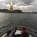 Priyanka Chopra Instagram - Lol! We r all statues of liberties ! Boat ride along the Hudson. I'm in a New York State of mind.. @jazmasri @chopramm2001 @mdesante