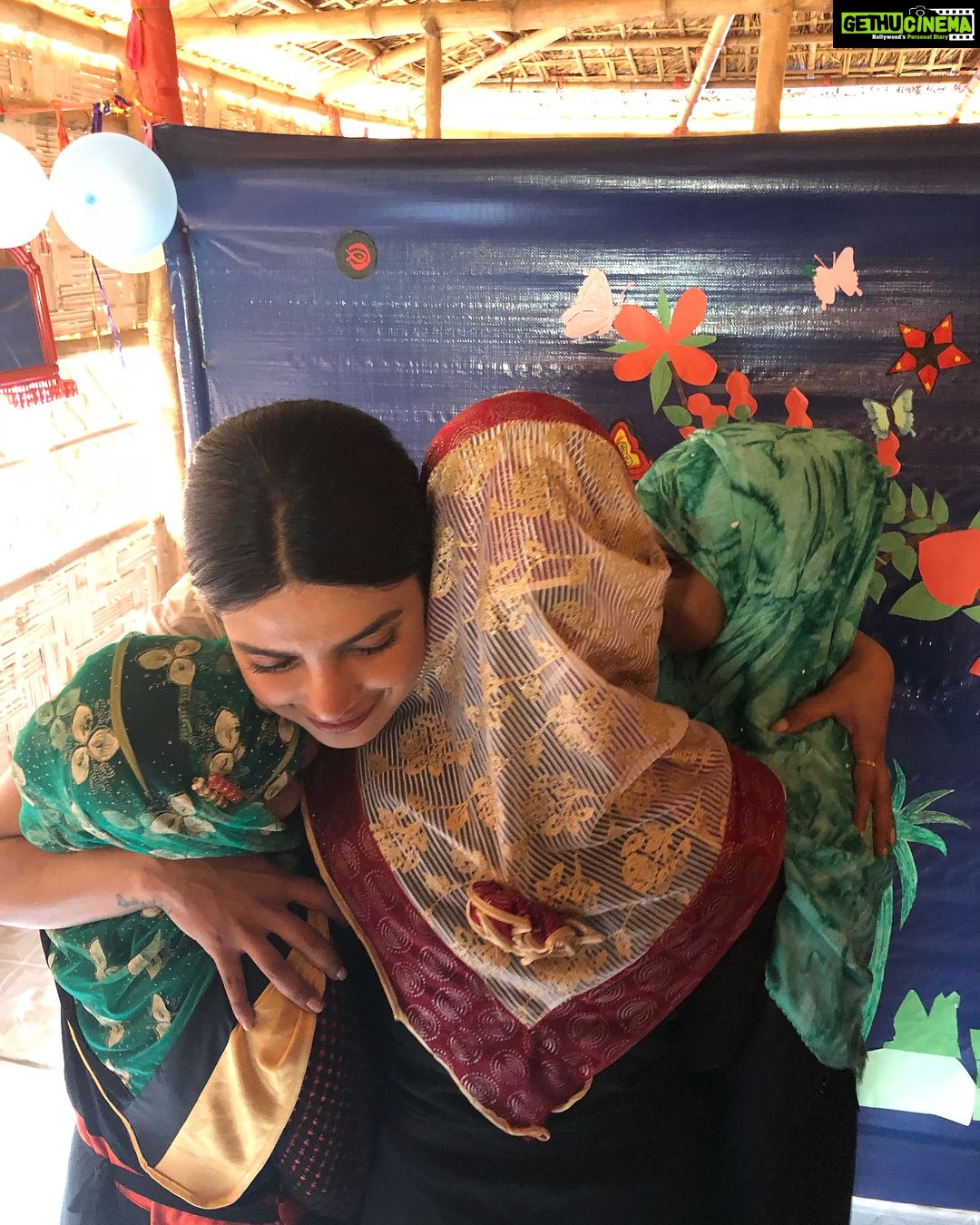 Priyanka Chopra Instagram - As I walk into the Women Friendly Space at the Jamtoli Camp, I am instantly struck by a certain calmness. These camps are loud & crowded, actually overcrowded, and so to find a quiet oasis, in this case a small hut with a tarp roof and thatched bamboo walls, is surprising. But for the girls in this camp, this is what they call their “house of peace.” It’s a place they can come and just be. A place to interact with friends, seek counselling, learn about hygiene, or learn life skills like art and music. There are approx 50 Women Friendly Spaces in the camps, just like this one, that on any given day see 50-70 Rohingya girls seeking these safe havens. The centers open at 9am, but there is seldom a day when the women aren’t lined up early, waiting for the doors to open. It is here that I met three 18 year old young women, in particular, who’s stories really shook me - their names have been omitted to protect their identities. They recounted lives of pain and suffering so horrifying...it’s difficult to fathom. One scarred with memories of houses in her village being burned - she and her parents traveled for two days to get here, passing hundreds of decapitated and dismembered bodies along the way. Another shared stories of young girls being pulled from their homes to be raped and tortured. They even tried to kill her and cut her with a knife, but she fought back. How did you manage to be so brave, I asked her...she replied, “If you’re born you will die, so I’m not scared of dying today.” In what world is it normal for an 18 year old girl to have this perspective on life?! The third young woman traveled for nearly two weeks on foot through the forest, where her youngest brother died along the way. There was lots of rape and torture back home she told me, and some women’s breasts were even cut off. While their lives are safer now, they are all still struggling. They know that with an education they can get a job and create better lives for their family, like buying protein for their meals, and clean drinking water. It’s literally as basic as that. Please help however you can, no donation is too small...go to www.supportunicef.org #childrenuprooted @unicef Cox's Bazar, Bangladesh