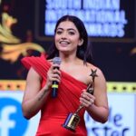 Rashmika Mandanna Instagram - My heart is filled with gratitude and happiness. ❤️ This is just the beginning.. ✨ And thankyou my peeps @_santhosh_mohan_ @ay_ivn @arudravavilapalli @benchmarkdigitalofficial for being my +1’s.. 😚 It’s too boring without you. 😄 And a huge thank you to my team♥️ Outfit - @gauravguptaofficial Stylist - @geetikachadhaofficial Makeup Artist - @goldandglittr Hairstylist - @chakrapu.madhu #SIIMAONREELS @siimawards