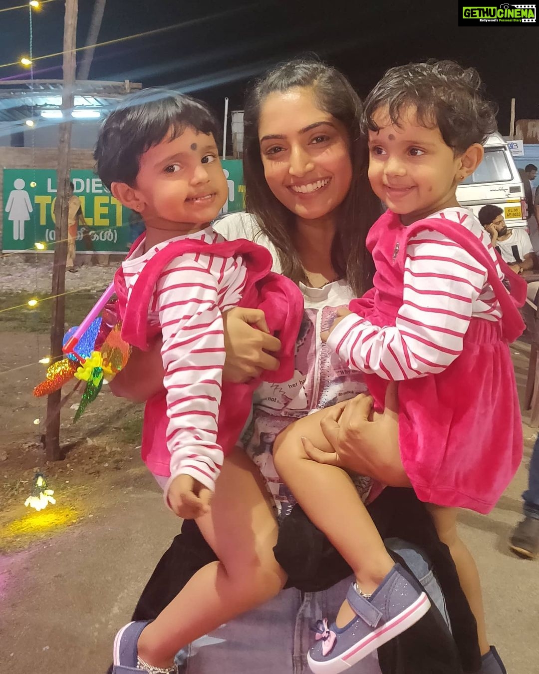 Reba Monica John Instagram - TWO IS BETTER THAN ONE 🤩✨ You'll know who these cutie patooties @adhunannu are if you've watched FORENSIC. I've always loved kids especially been fascinated by twins and I was super adamant I wanted pictures holding both simultaneously. If only I knew the struggle! I succeeded nonetheless, after making a couple of false promises ( to buy them chocolates lol ) p.s They got their chocolates in the endddd...and I still love kids as much. #missingshootdays #ilovekids #twinsisters #throwback🔙 #forensicmoviedays #carnival