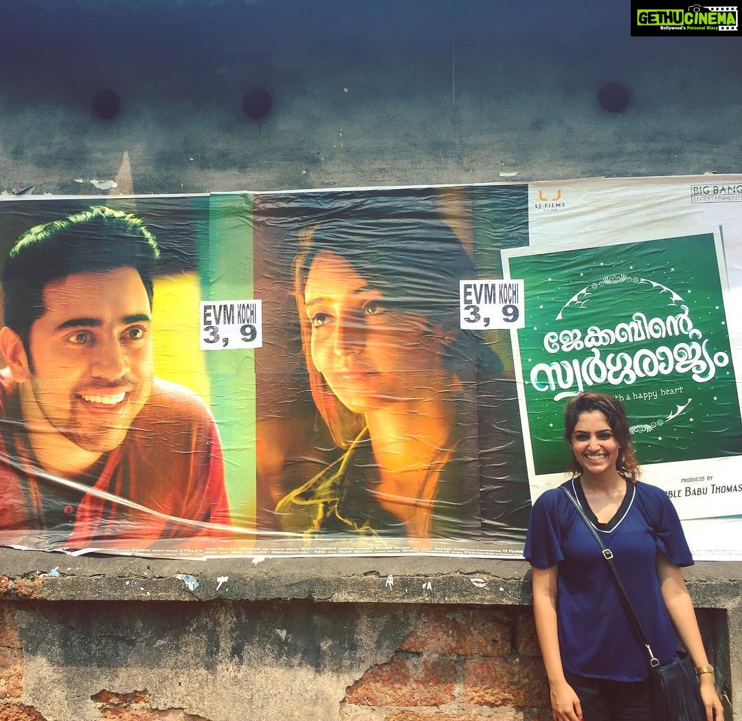 Reba Monica John Instagram - Posing beside a poster🙊 #jacobinteswargarajyam #FortKochi #movie #poster #feel