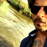 Shah Rukh Khan Instagram - A dog day afternoon feels fine with a dip & a bottle to the lips