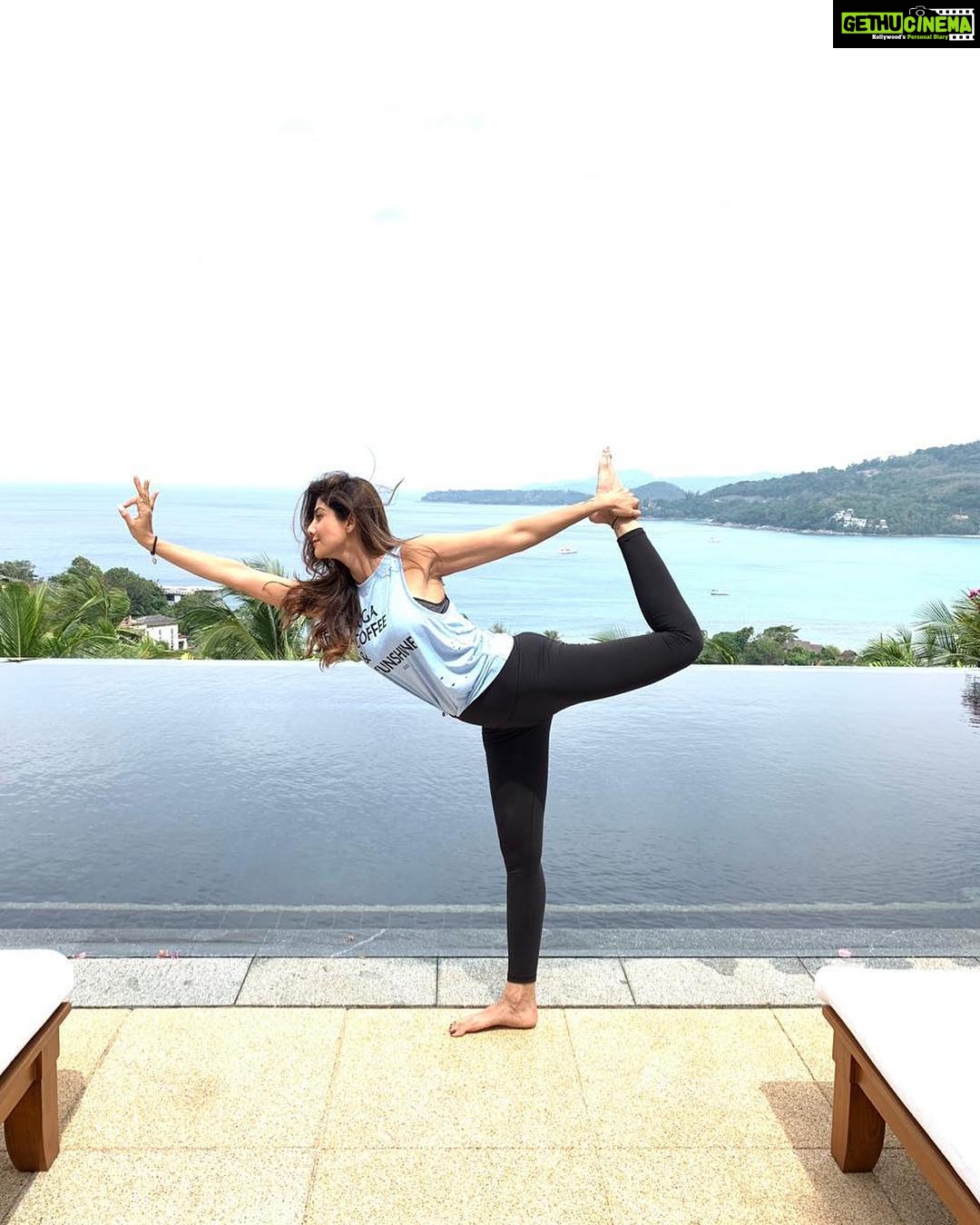 Shilpa Shetty Instagram - Striking a pose... This Natrajasana (Lord of dance pose) looks straight out of a postcard... π§πΎββοΈ Great hip opener, sculpts arms and your calves... Enhances mental focus and back flexibility. Iβm just getting all set for tonightβs party... all set to #dance @shamitashetty_official ππ½ππ½ππ½πΆπ΅π #phuketdiaries #yogi #yoga #yogaposes #yogainspiration #routine #health