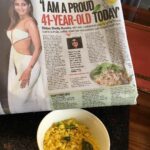 Shilpa Shetty Instagram – Reading the morning papers eating my Poha with Gratitude. Thank u @hindustan_times for the credit and compliment.🙏😅😁#lifestylemodification #thegreatindiandiet #ipracticewhatipreach