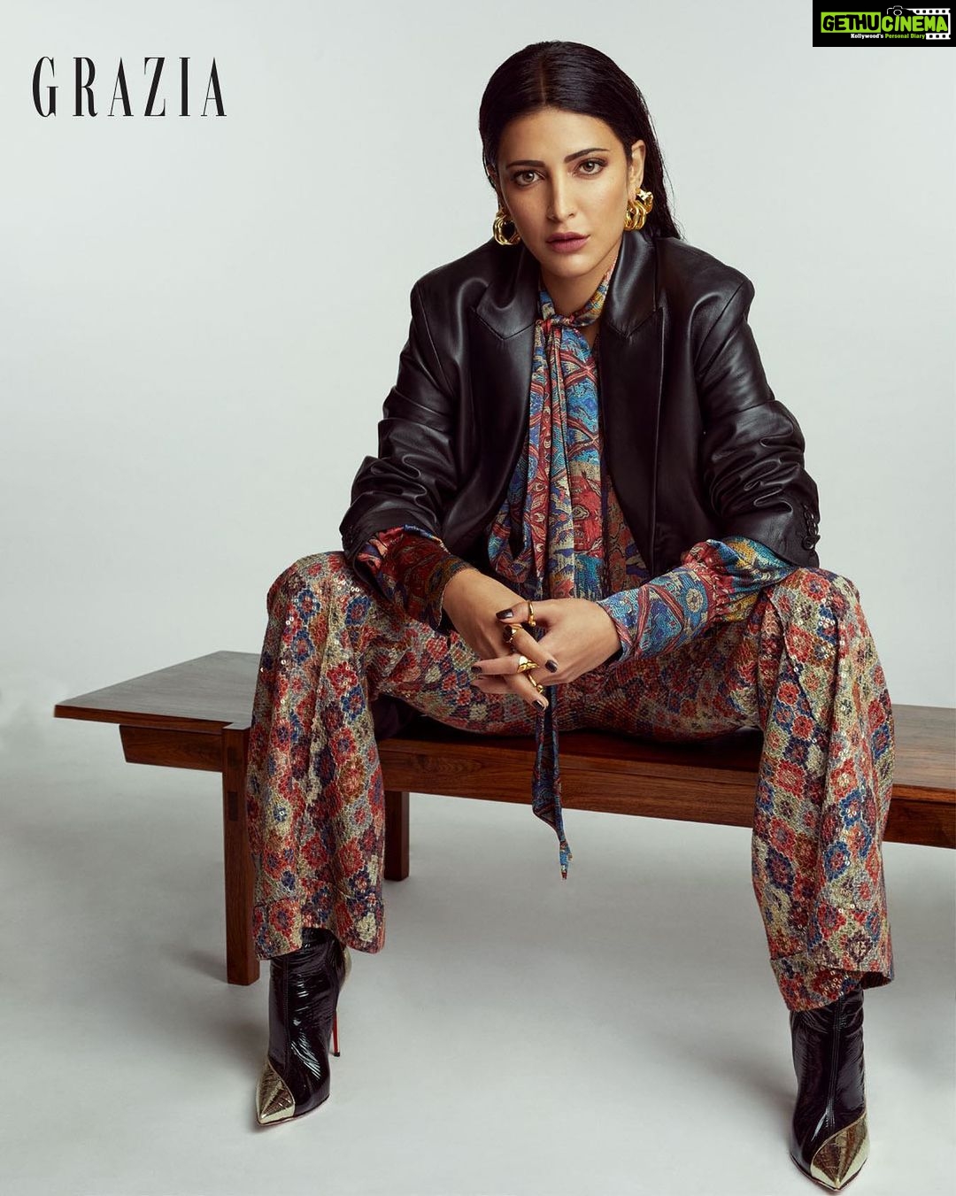 Shruti Haasan Instagram - 🧡🖤 Carpet print satin silk shirt, carpet print sheeted crepe trousers, both @NikitaMhaisalkar, faux leather jacket, @H&M, ‘Bibooty’ boots @ChristianLouboutin, mini flow hoops, stackable pebble rings, flow combination rings, all @Misho, apollo double trouble crater hoops, divided signet ring, both @ShopLune, Java coffee table, @barodesignindia @graziaindia Jan 2021 Photographed by @aneevrao Styled by @surbhishukla Fashion assistant: @thestyleattendant Hair and make-up: @devikajodhani assisted by @ritashukla22 Words: @barrynrodgers PR: @p2communication